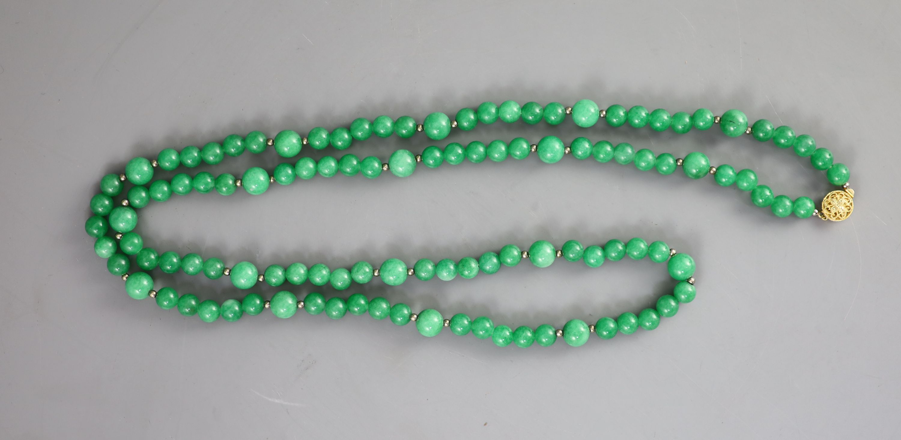 A Chinese green jadeite bead necklace, 51cm drop